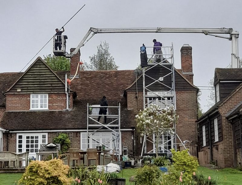 The Roof Moss Cleaners using cherry picker and scaffolding to clean roof safely and professionally in Chipping Norton, Oxfordshire