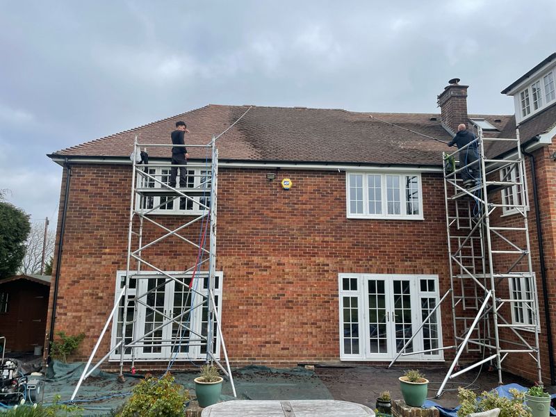 Roof cleaning carried out safely from scaffold towers by The Roof Moss Cleaners in Chipping Norton